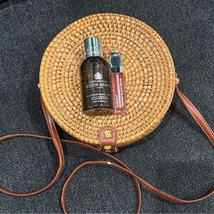 Round Woven Straw Bag with Brown Leather Strap, Shower gel & Lip Oil